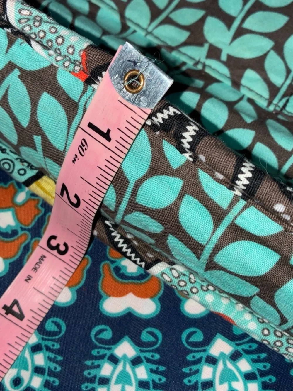 Vera Bradley Quilted Bag with Teal Floral Pattern on Brown